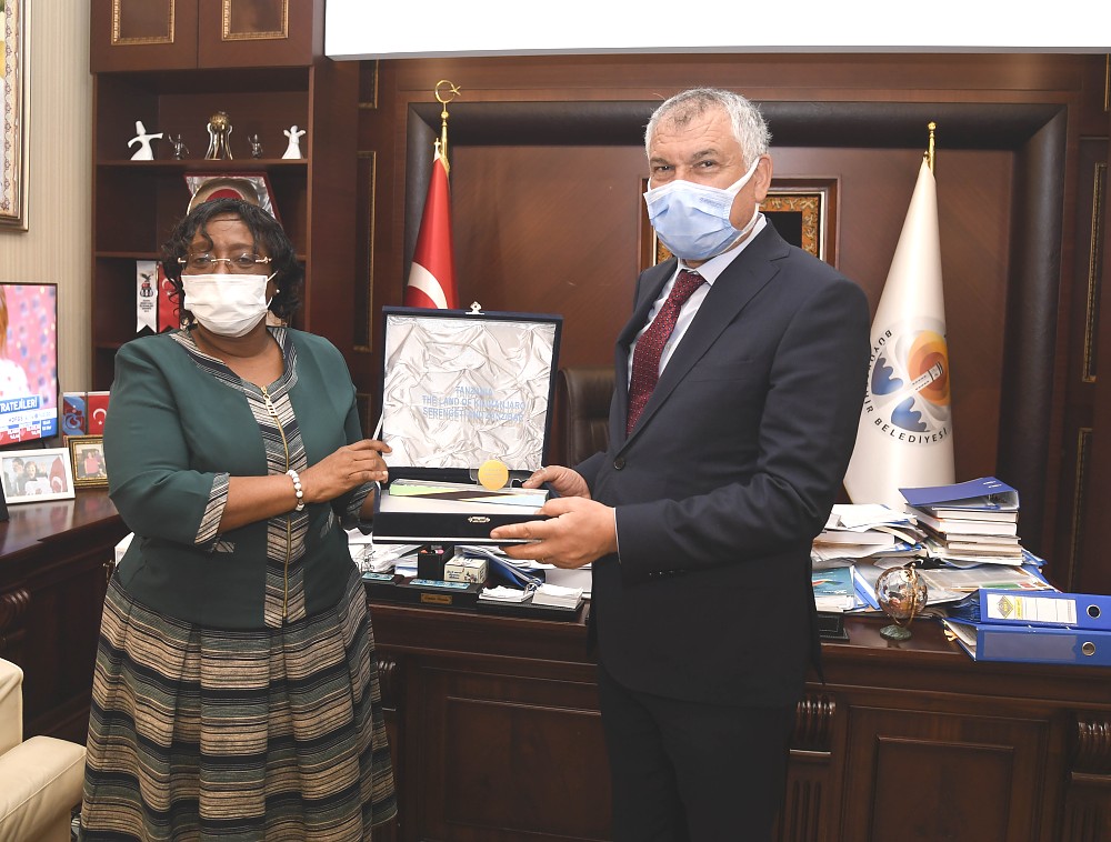 H.E Prof. Kiondo handing a Tanzania map to the Mayor of Adana Mr. Zeydan Karalar at Mayor's office.